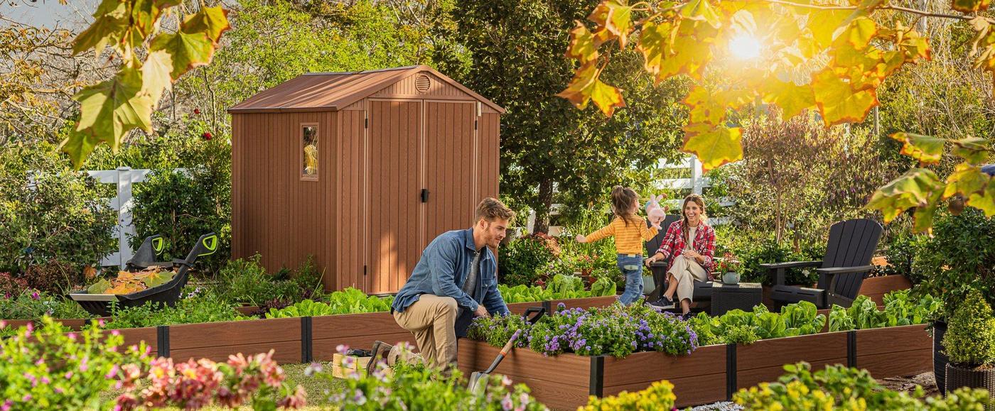 Raised planting beds beside a garden shed